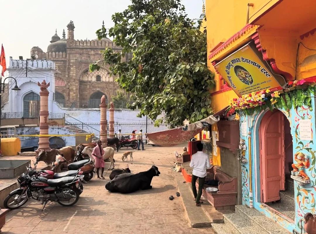 The Bindu Madhav temple complex at Panchganga Ghat, with its painted doorway and the trust signboard in Devanagari